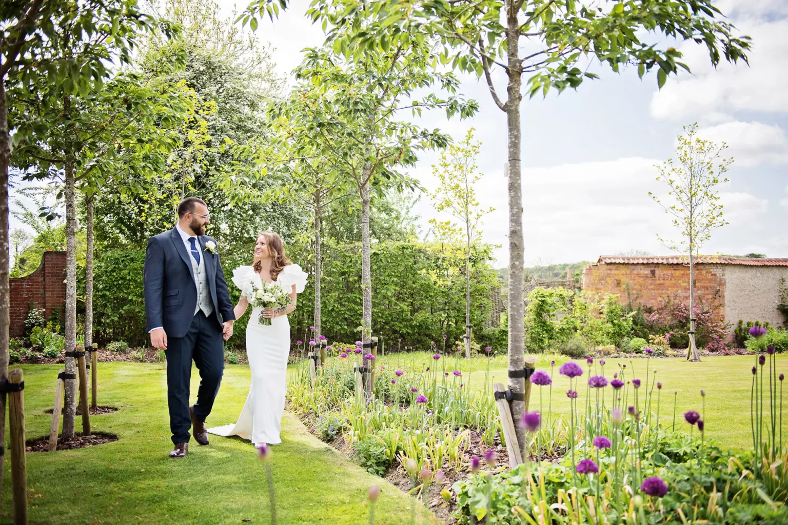 syrencot wedding gardens couple walking gardens